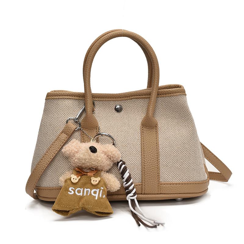 Korean version of casual niche contrasting color splicing portable bucket bag fashion versatile temperament casual commuter messenger bag woman