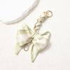Elegant Hand-Woven Scarf Chain with Bow Decoration Pendant for Bag Strap Modification.