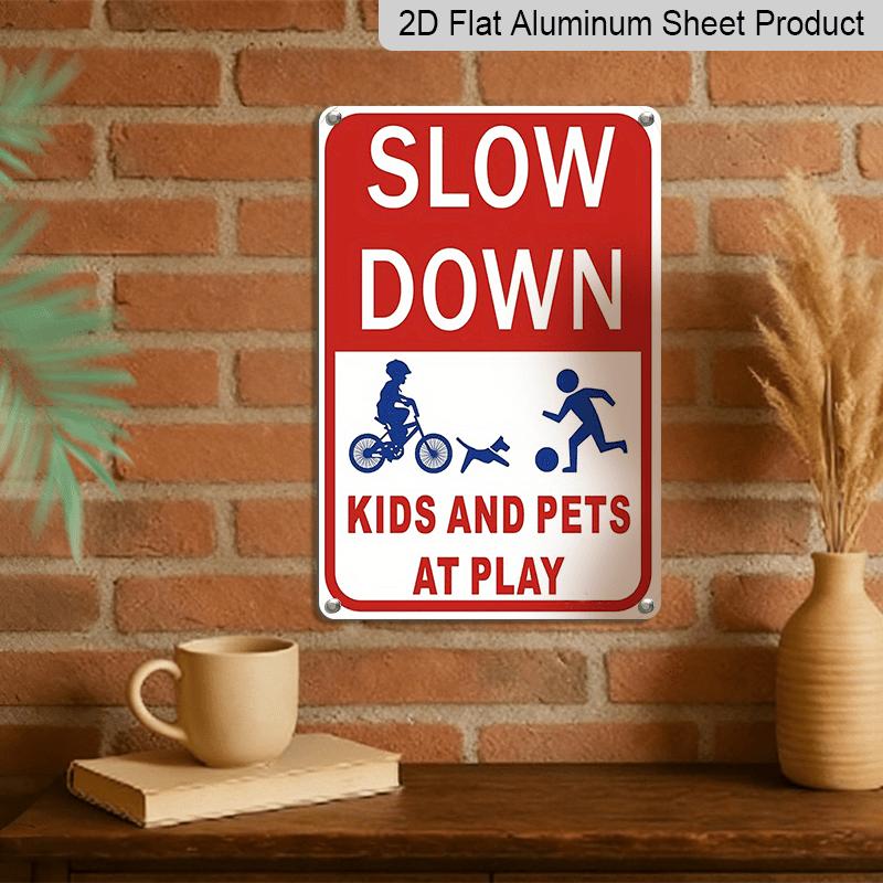 2D Flat Slow Down At Play Metal Sign - Durable Metal Safety Signage, 12*8 Inches, Easy To Install, Red and White with Blue Graphics, Perfect for