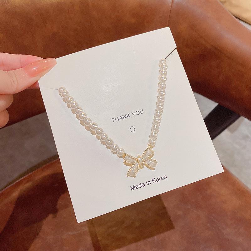 "Elegant Korean Titanium Steel Zircon Bow Necklace for Women"