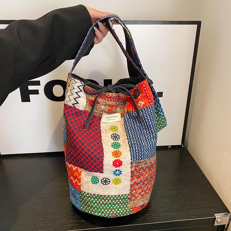 

Spring new splicing contrasting color bucket bag female versatile denim double-sided back messenger bag червоний