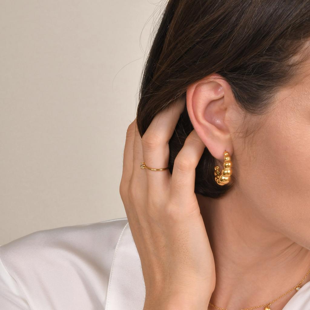 Stainless steel earrings C-shaped earrings U-shaped hollow hollow hollow embossed irregular zircon element earrings