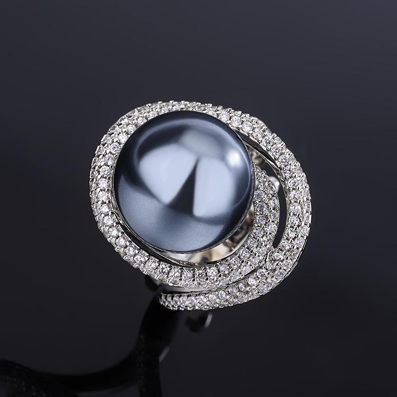 

Ювелирные изделия Покрытая медью Настоящее золото Инкрустированный жемчугом Кружевной темперамент Бриллиантовое кольцо Женское 14 мм