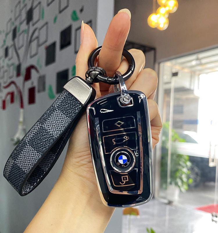 

Серебристый TPU Чехол для ключа BMW с серебристой окантовкой для X3, X5, X6, Новых 5, 7 и 3 Серий - Черно-белый корпус ключа с пряжкой.