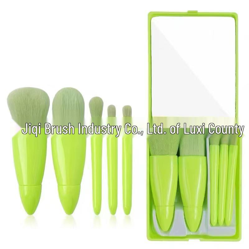 

Compact 5-Piece Travel Makeup Brush Kit with Mirror: Includes Powder, Foundation, Eyeshadow, Blending, and Lip Brushes.