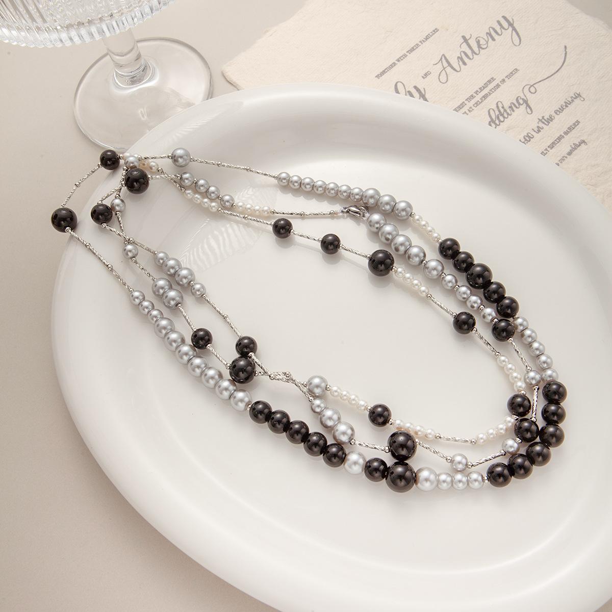 У Ни Ни такая же винтажная высококачественная цепочка на шею, длинное двухслойное ретро-ожерелье с черными бусинами, нишевое простое ожерелье.