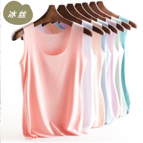 Haut d'été sans coutures à fines bretelles pour femme, polyvalent et sans manches, idéal comme base pour une coiffure tendance.