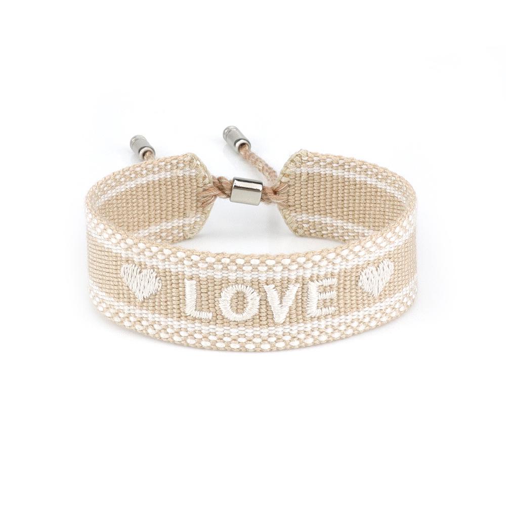 European-American Woven Women s Bracelet: Embroidered Letter, Alloy Bell, Handmade Tassel Wristband.