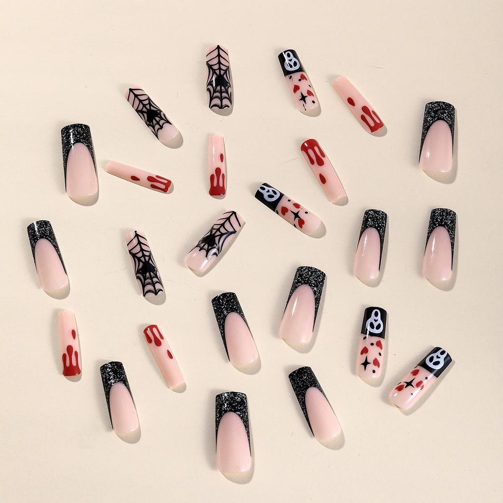 Wearable Halloween Nail Art: Long Pipe Nails with Stars, Hearts, Ghosts, and Spider Webs.