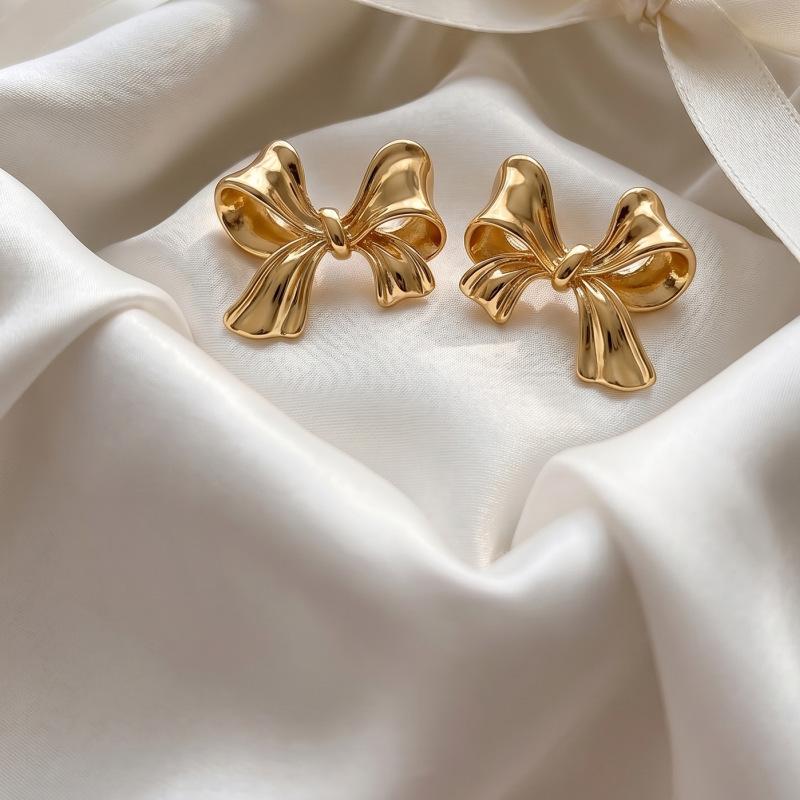 Hot-selling French gold bow stud earrings women's small fresh tied sweet earrings personalized ear jewelry stud earrings