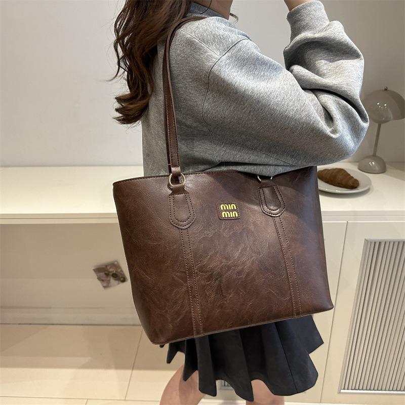 Simple casual tote bag, new fashion commuter shoulder bag, niche design handbag