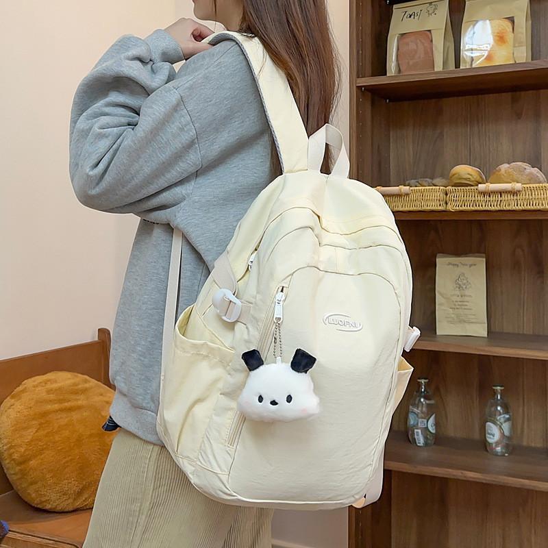 Simple Solid Color Letter Embroidery Student Backpack With Plush Pendant For Middle School Students