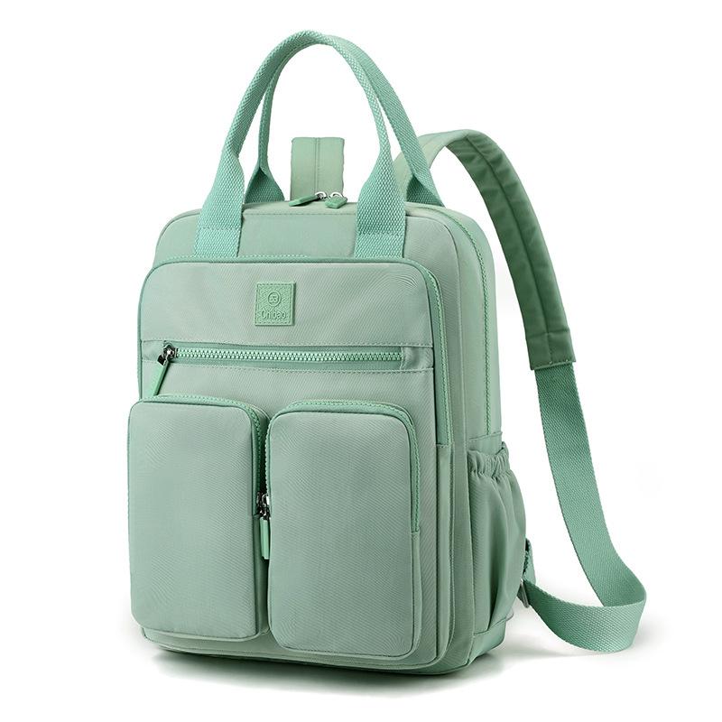 

Новий якісний жіночий рюкзак. Зносостійкий. Зносостійкий портативний нейлоновий рюкзак через плече. Дорожній рюкзак. світло-зелений колір