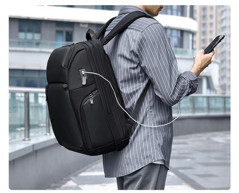 High-Capacity Waterproof Unisex Backpack: Trendy Travel & School Bag with Laptop Compartment