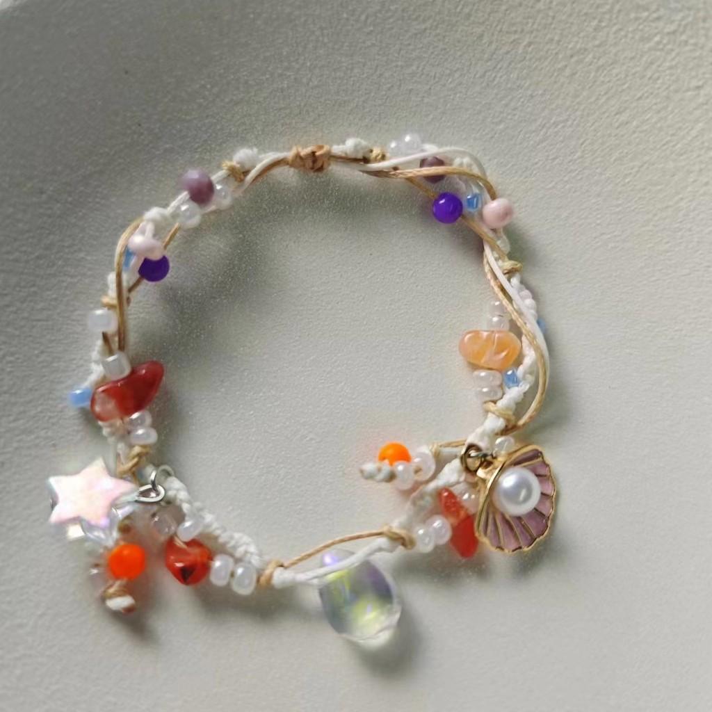 

Уникальный красочный браслет в виде пятиконечной звезды с каплей воды и акцентами из жемчуга Drop Shell