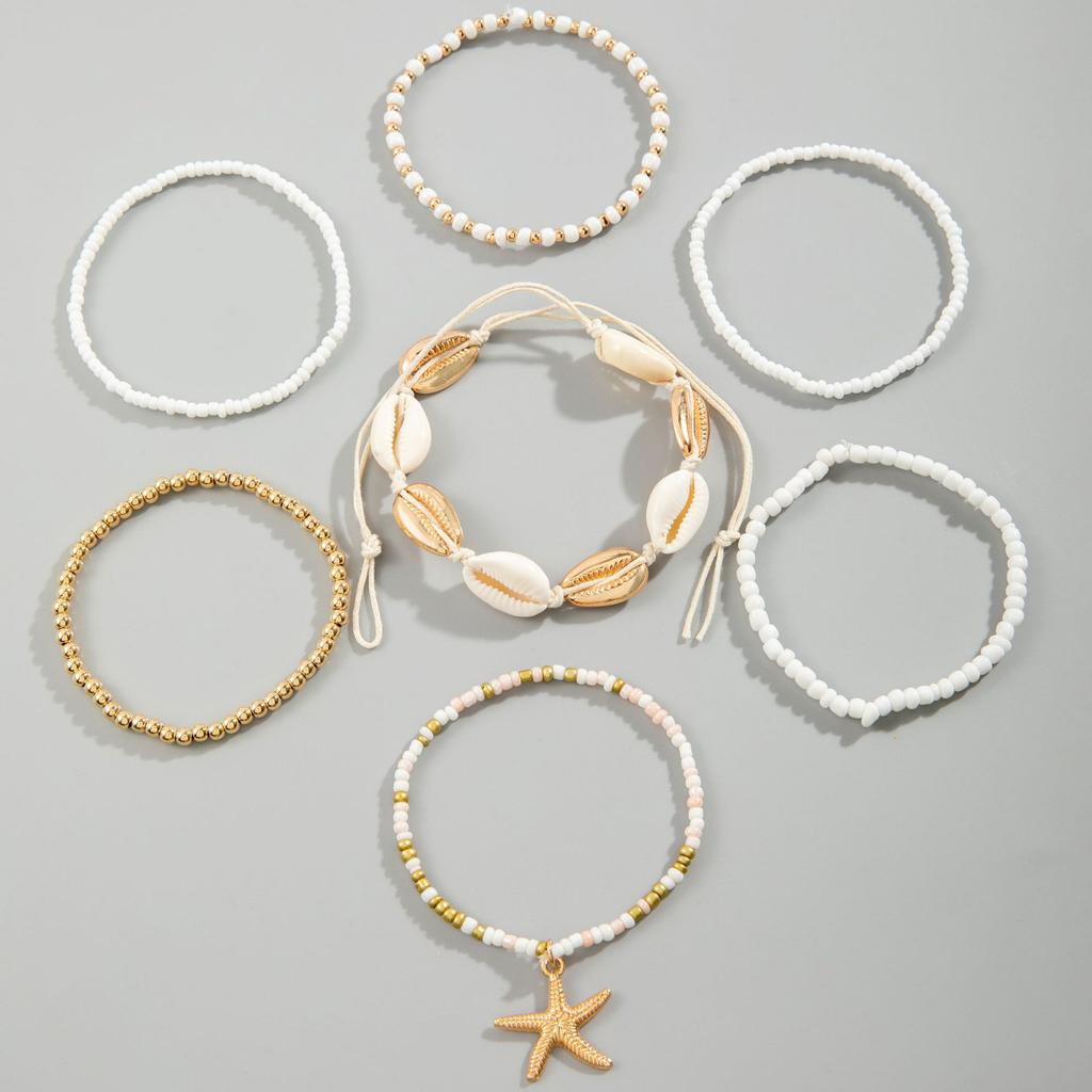 Plażowy Casual Modny Imprezowy Prezent dla Kobiet Wakacyjny Zestaw Bransoletek z Linki z Nawlekanymi Koralikami Ryżowymi Gwiazda Morska Akcesoria na Rękę Bohemski Zestaw 7 szt.