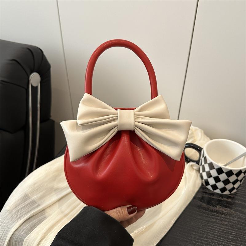 Niche design bow handbag new sense contrasting color small round bag fashionable versatile high value women