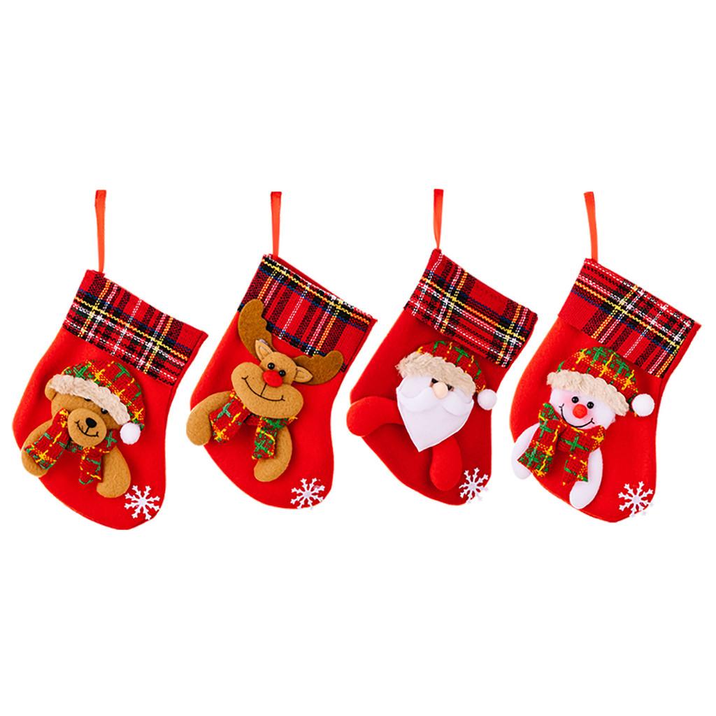 Decorative Red Christmas Stockings With Fun Cartoon Designs Of Santa Snowman Reindeer Bear For Vibrant Celebrations Festive