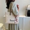 Woven large-capacity bag women's 2025 new spring commuter letter tote bag silk scarf versatile shoulder armpit bag