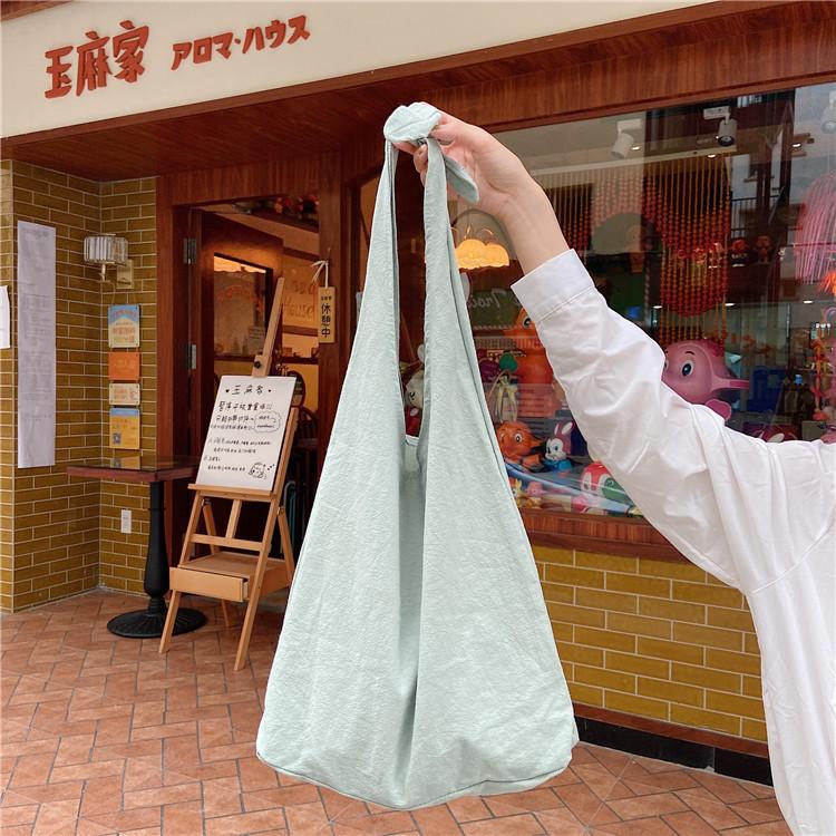 

Korean version ins fresh plain color solid color shoulder bag portable, literary and artistic schoolgirl cloth bag laceup vest bag
