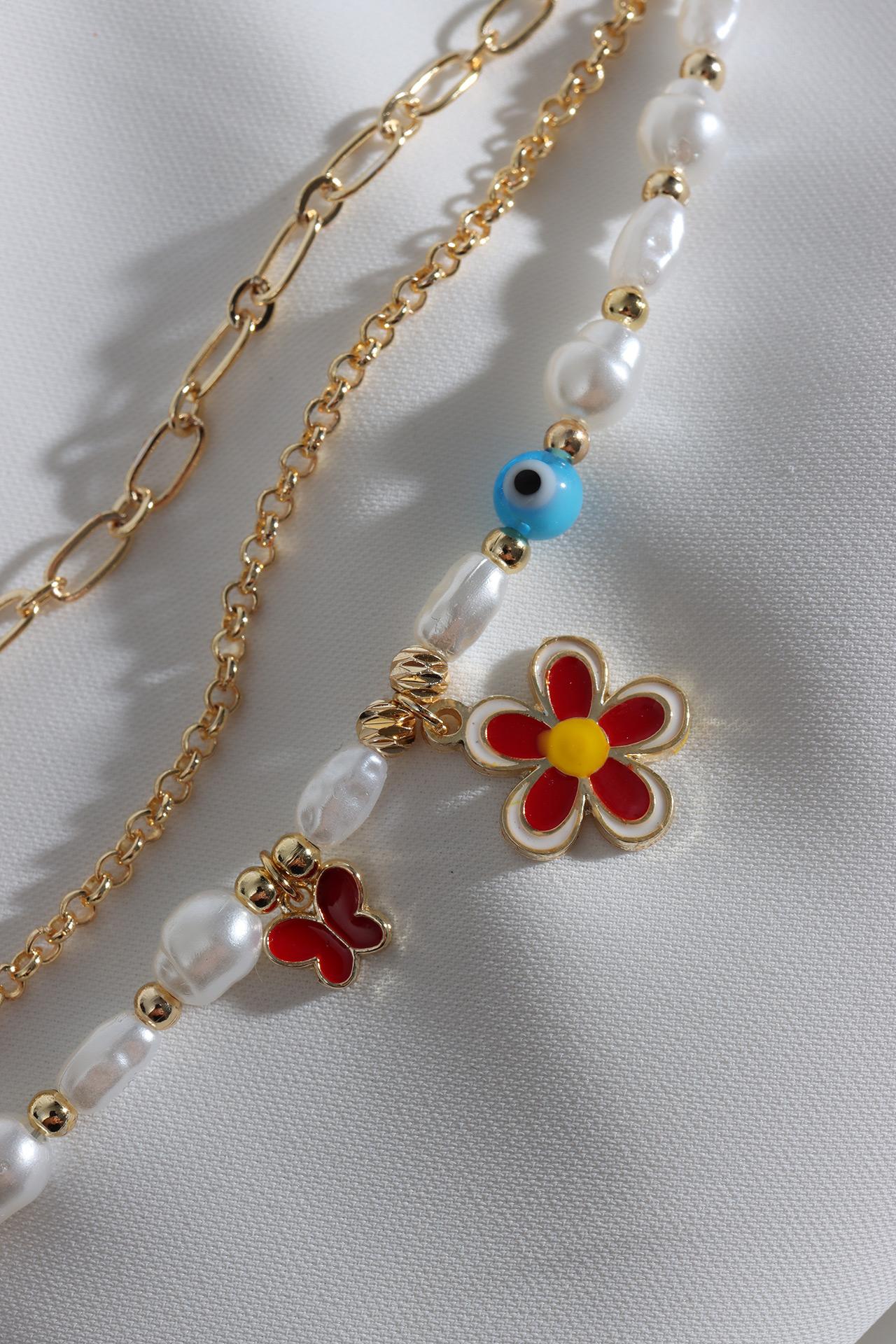 

Трехкомпонентный браслет-цепочка с красным жемчугом и маргариткой
