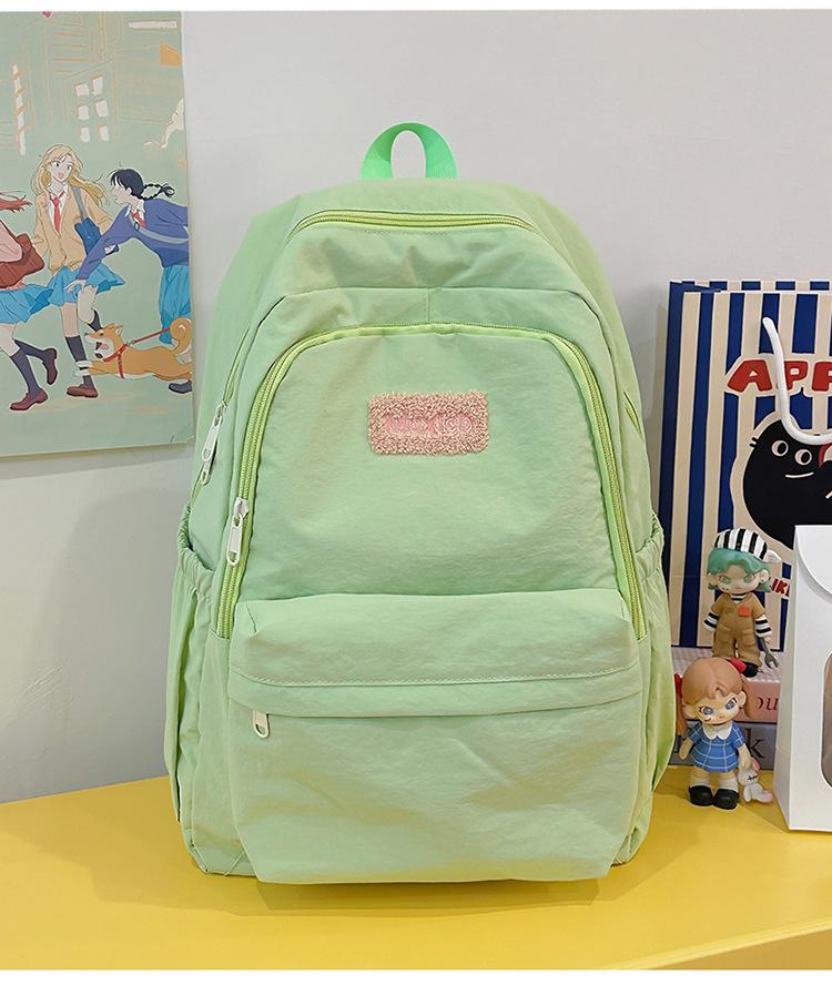 School bag 2025 new large-capacity sweet and cute college student school bag Korean version fresh and versatile backpack casual and lightweight bag