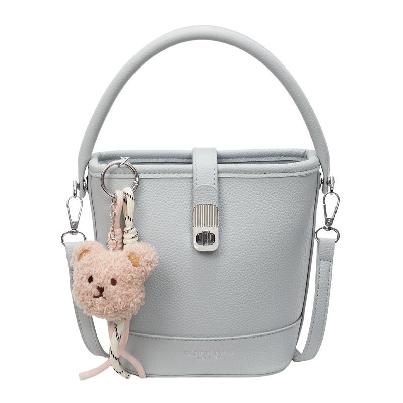 

Оптовая продажа популярная корейская простая однотонная сумка-ведро с высоким чувством качества, портативная, модная и универсальная рабочая сумка-мессенджер для通勤 для женщин синий