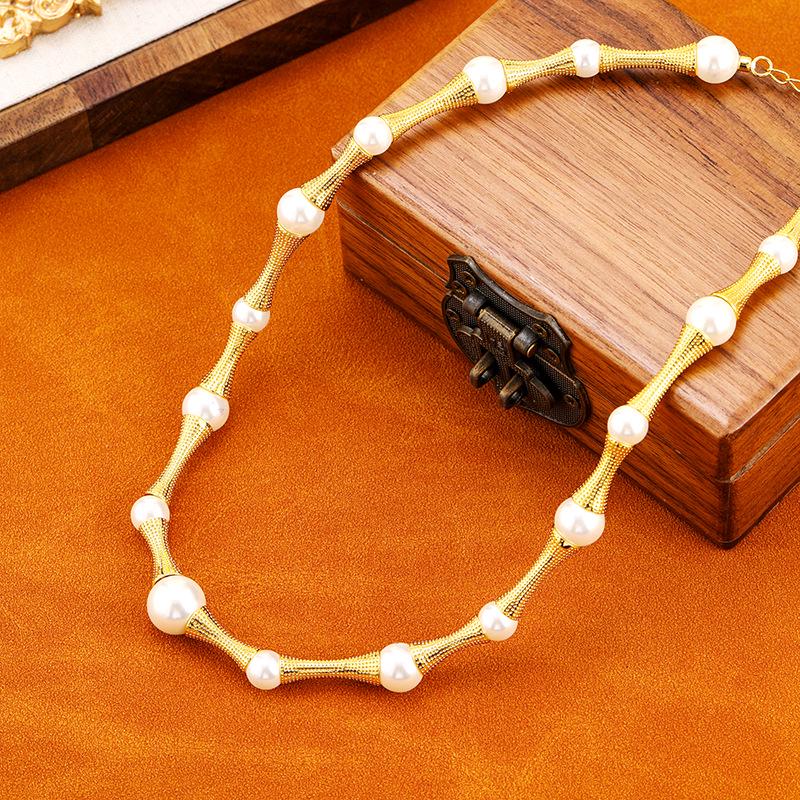 

Copper-Plated Gold Pearl Bamboo Necklace - Retro Small Waist Design for Women