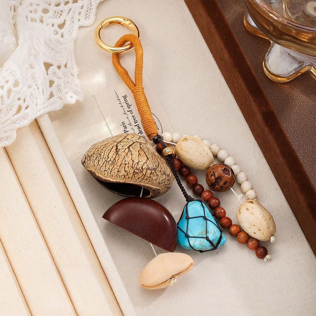 Handgefertigter Nussschalen-Taschenanhänger Samen-Wind-Rassel-Glocken-Taschenanhänger Schlüsselanhänger Anhänger