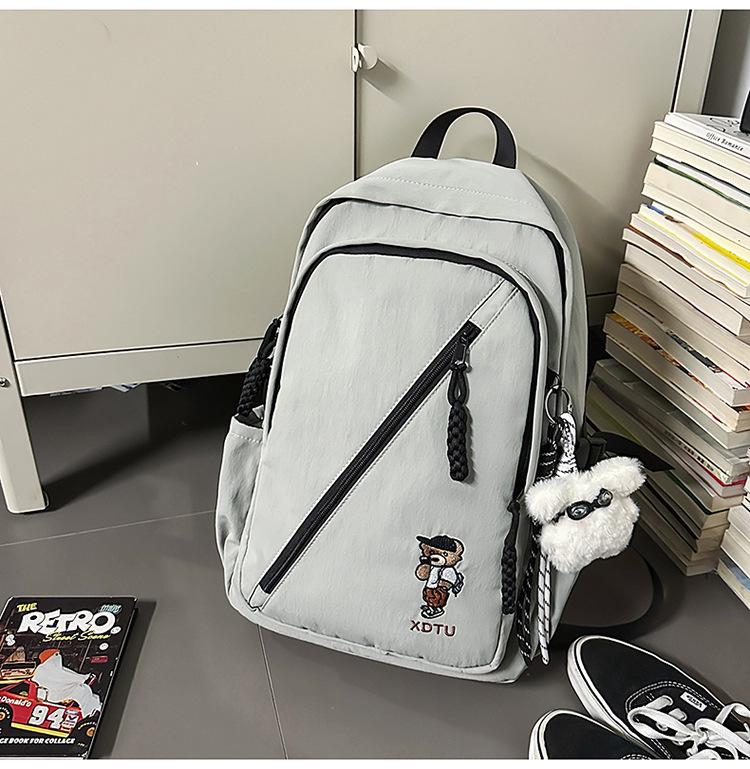 

2025 Trendy Unisex Backpack: Stylish, Versatile and Casual for Students With Pendant