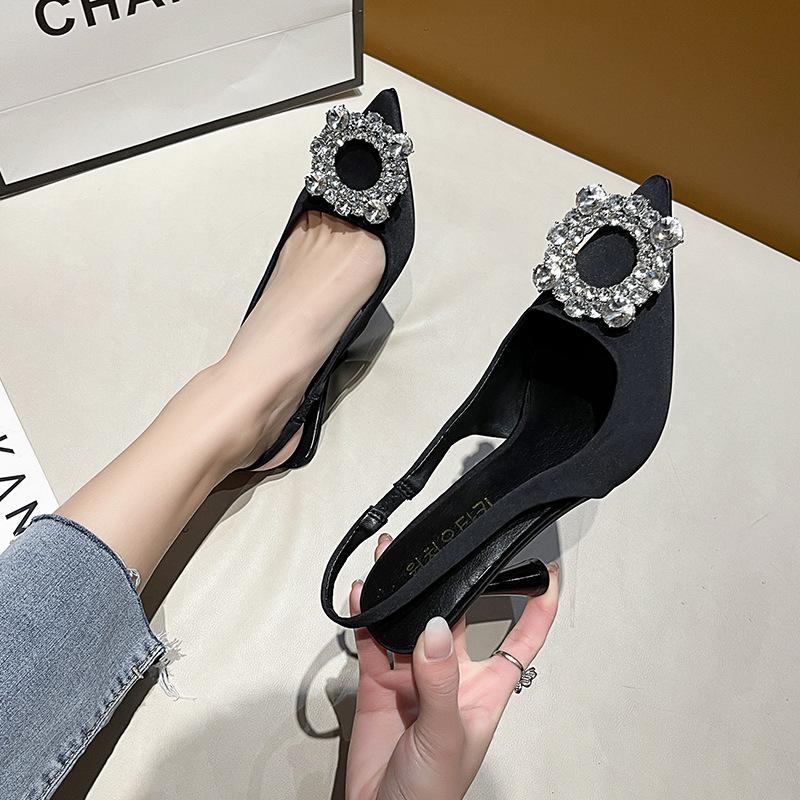 Black pointed high-heeled single shoes women's buckle rhinestones spring and summer new versatile side empty stiletto with skirt
