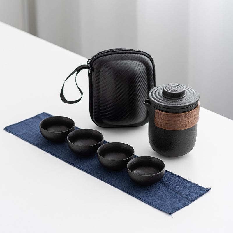 

Black pottery travel portable set, one pot, two or four cups, ceramic express cup, kung fu tea set, office business gift.