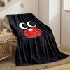 Large cartoon eyes and a red mouth with one tooth on a black background. for all seasons blanket lunch break throw gift