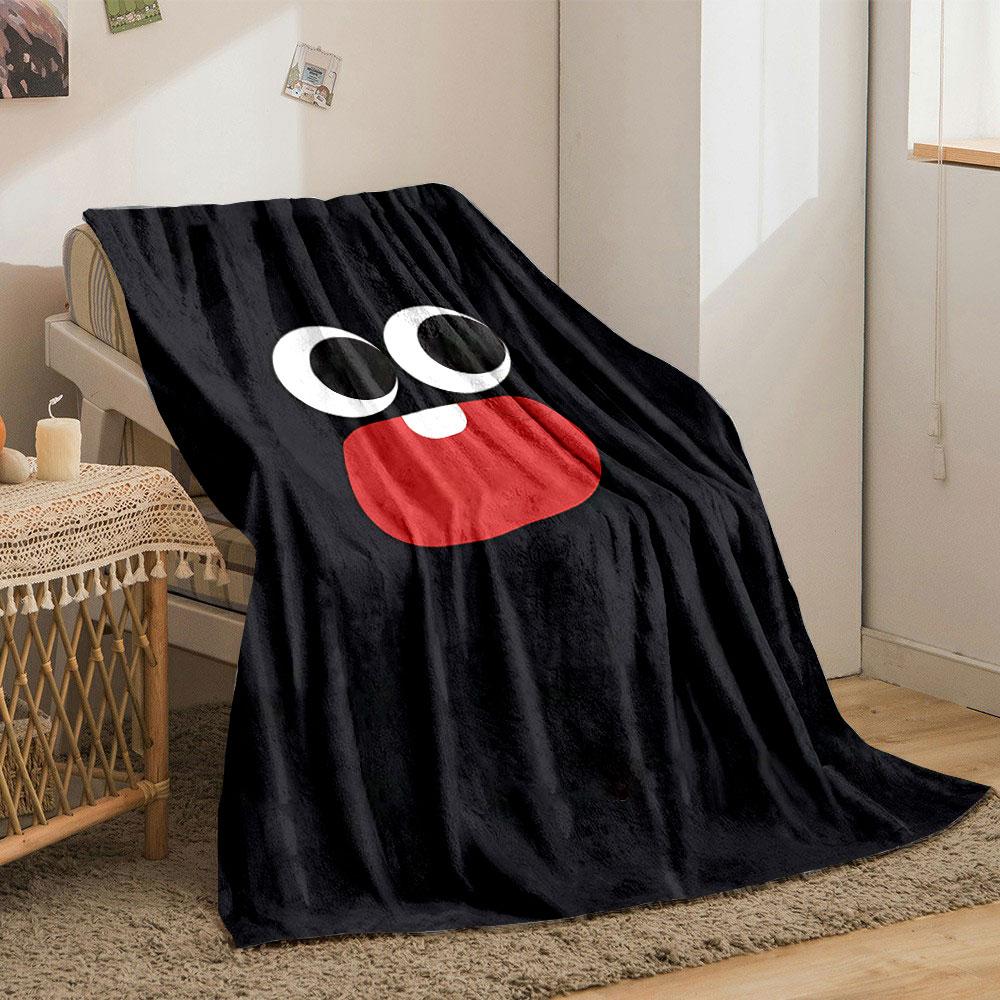 Large cartoon eyes and a red mouth with one tooth on a black background. for all seasons blanket lunch break throw gift