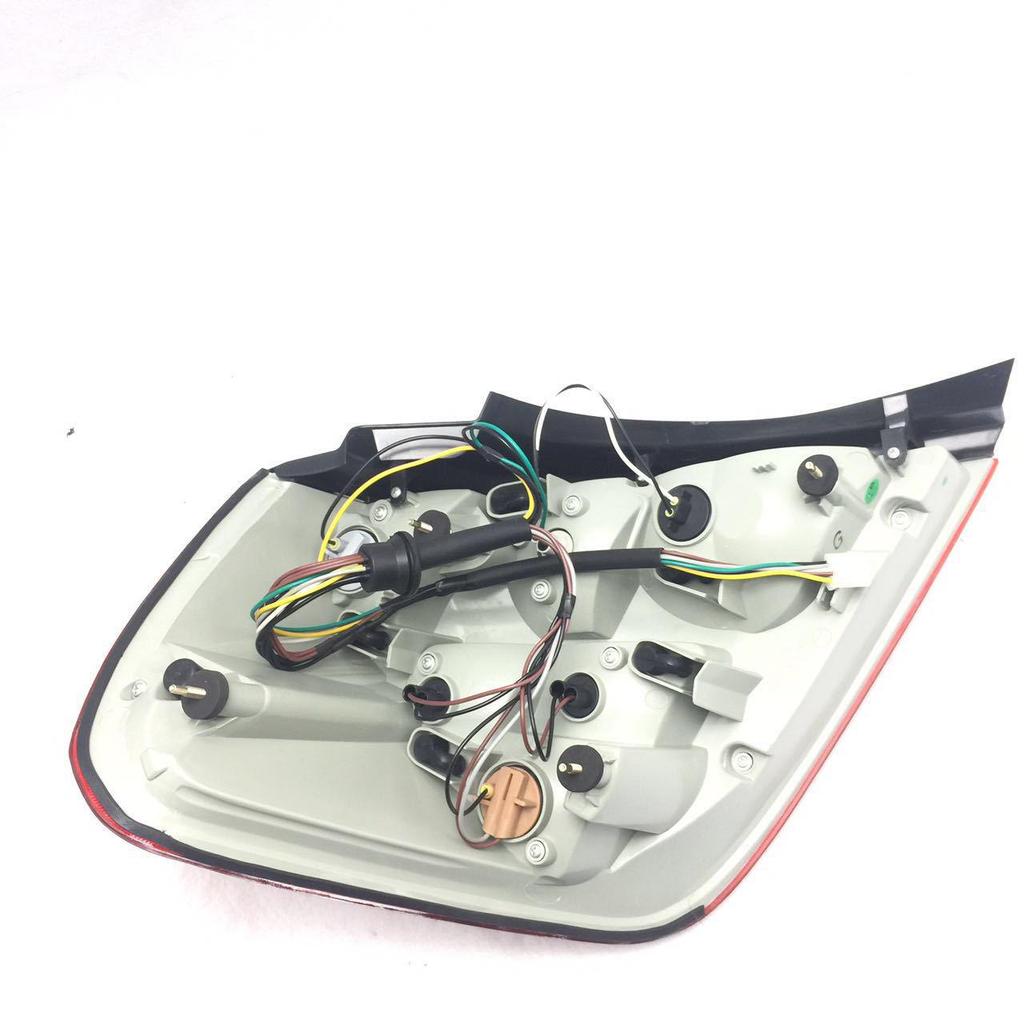Buick LaCrosse 08 Rear Tail Light Assembly: Red Brake, Turn Signal, and Rear Headlight.