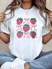 TShirt with a Strawberry Bow Print In a Youthful Style Featuring a White ShortSleeve Round Neck Machine Washable Casual Style