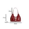 Solid color crescent-shaped hobo bag with metal D-ring embellishment, elegant underarm bag, versatile women's handbag for dates and everyday wear.