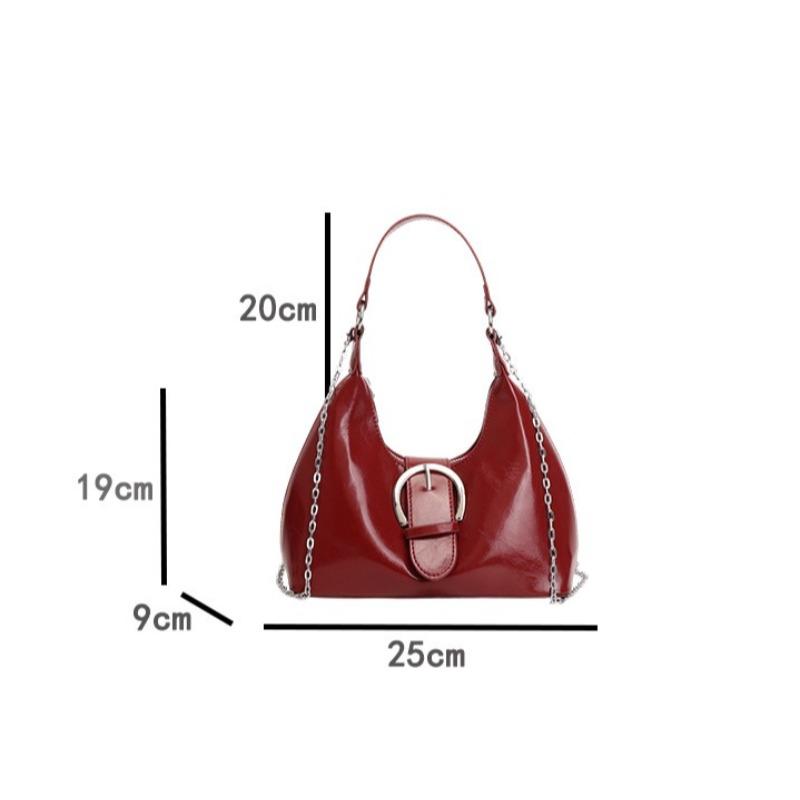 Solid color crescent-shaped hobo bag with metal D-ring embellishment, elegant underarm bag, versatile women's handbag for dates and everyday wear.