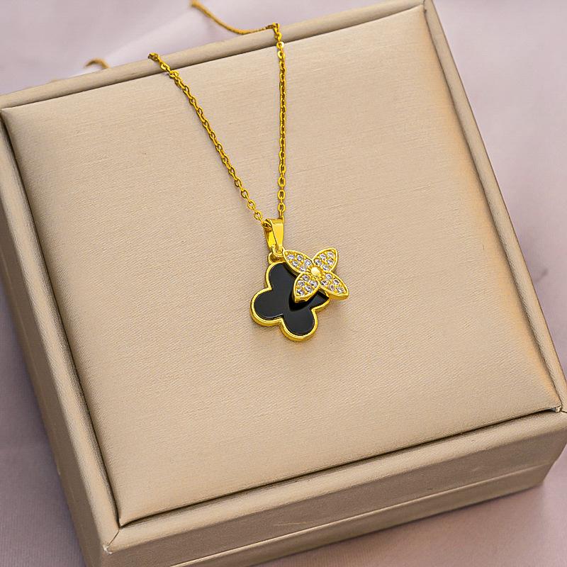 

Ожерелье из четырехлистного клевера из черного и белого перламутра, роскошный и изысканный универсальный аксессуар