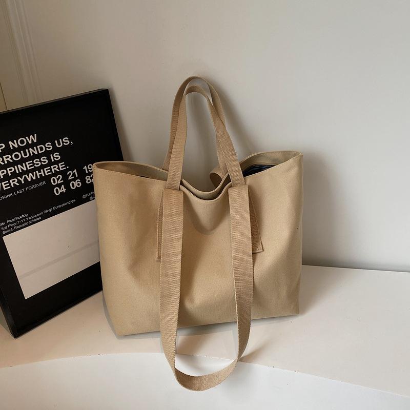 2025 summer new fashion simple solid color portable tote bag lazy wind commuting large capacity shoulder canvas bag