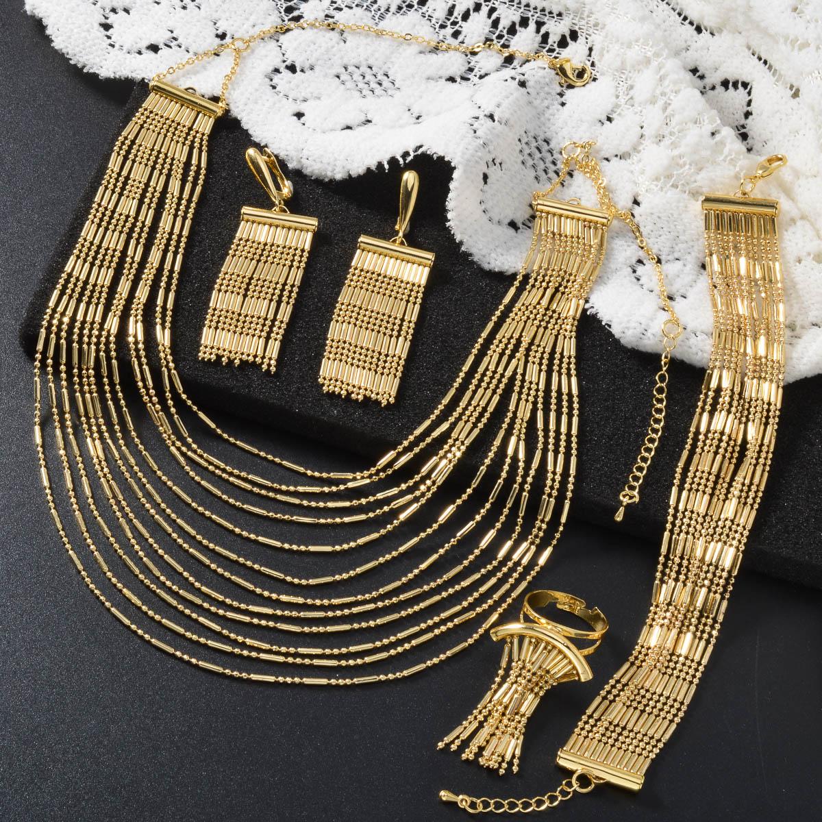 

Дубайский набор из четырех предметов с 18-каратным золотым покрытием: ожерелье, браслет, кольцо, серьги. Набор с многорядной цепочкой. Красивый свадебный набор для невесты. Подарки.