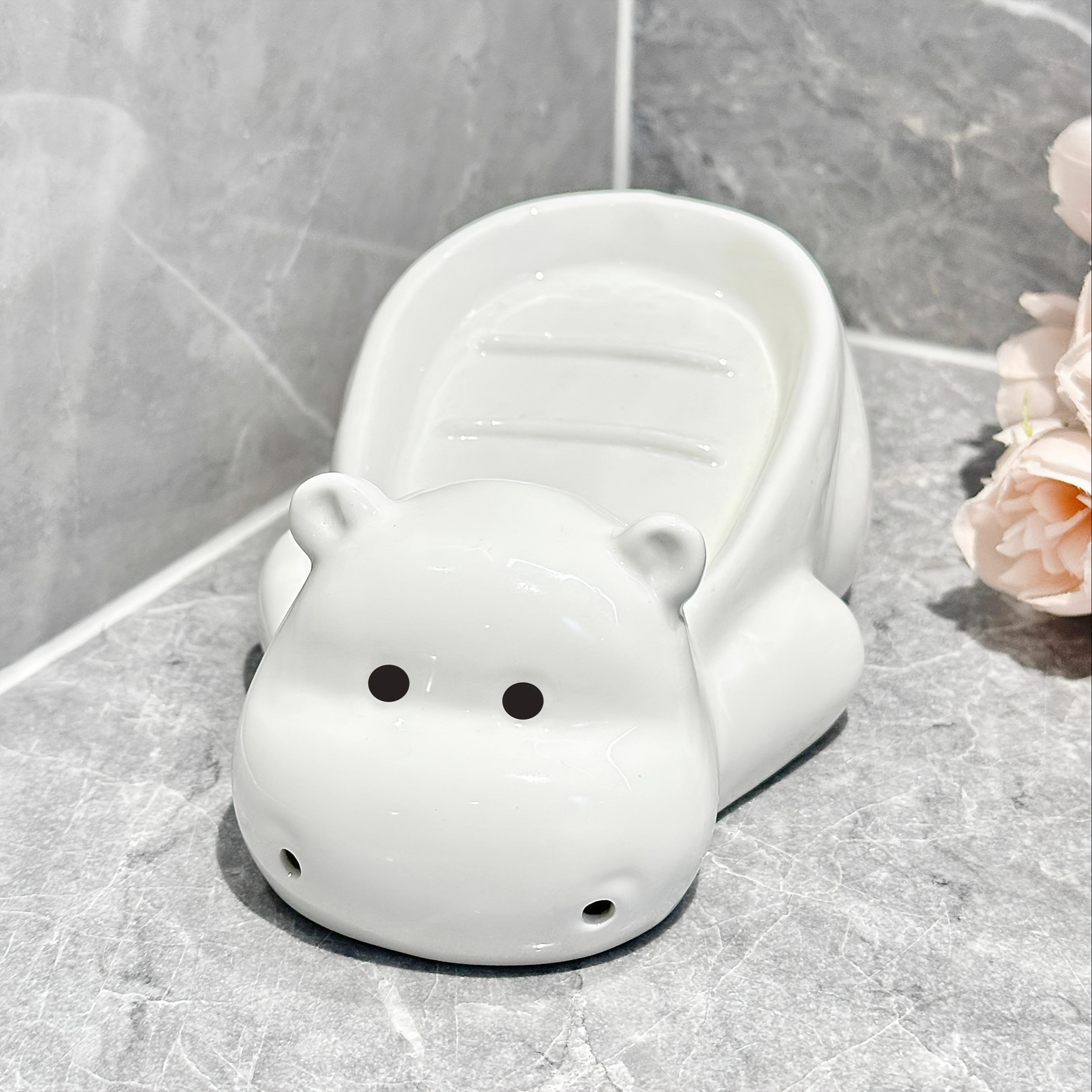 

Креативная керамическая мыльница в виде гиппопотама, подходит для различных размеров мыла, быстро стекает, не задерживает воду, очень хорошая полка для мыла для ежедневного бытового использования белый