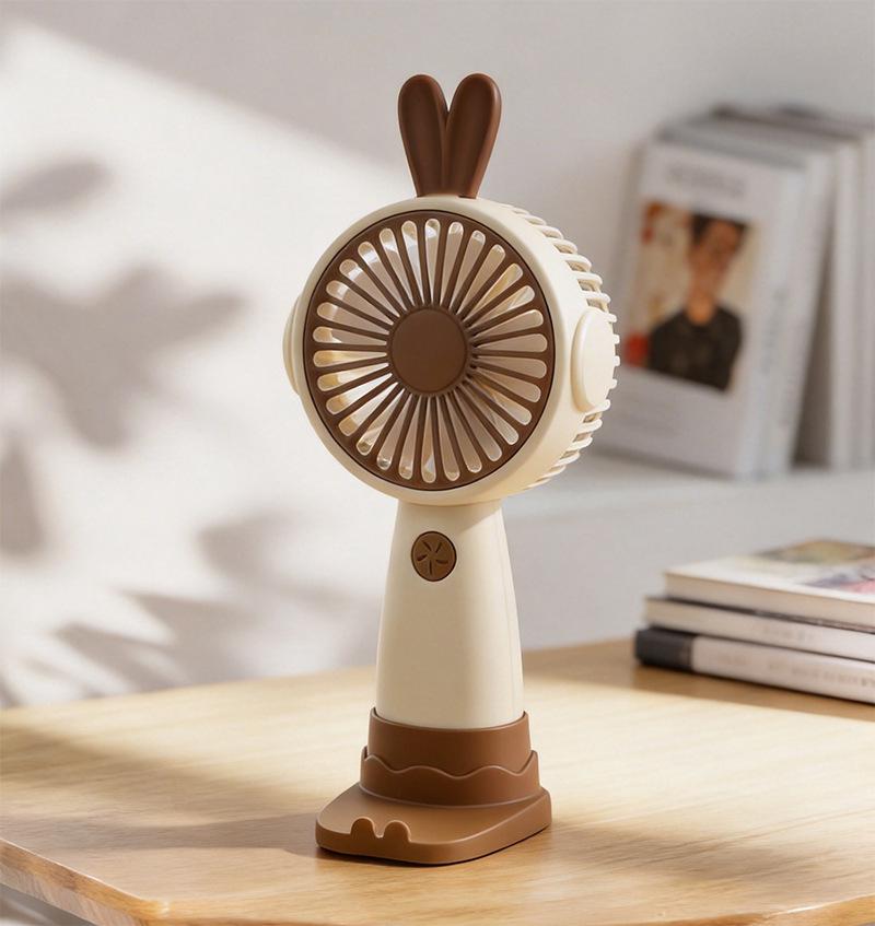 

Summer Cartoon Bunny USB Rechargeable Silent Mini Handheld Fan with Phone Holder Color Box Packaging + USB Charging Cable