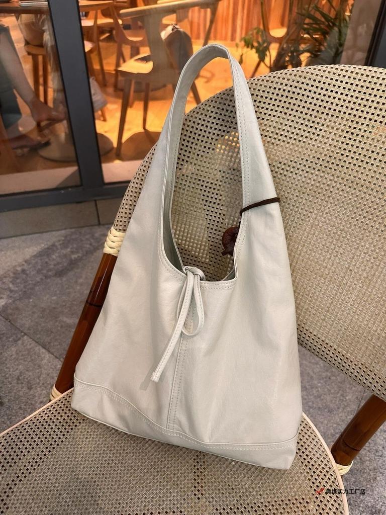 Korean bow strap solid color niche design portable underarm bag fashionable versatile lazy style texture tote bag