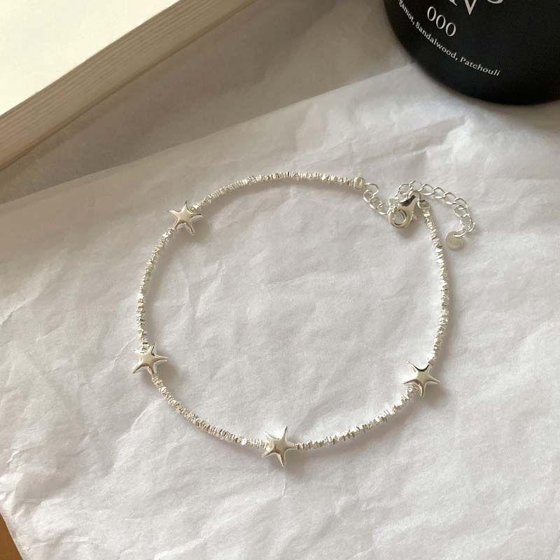 

2025 Новое поступление Изысканный сверкающий бриллиантовый серебряный браслет на ногу Женский Индивидуальный дизайн Кольцо на щиколотку Модные летние приливные аксессуары для ног 10cm Shattered Silver Star anklet