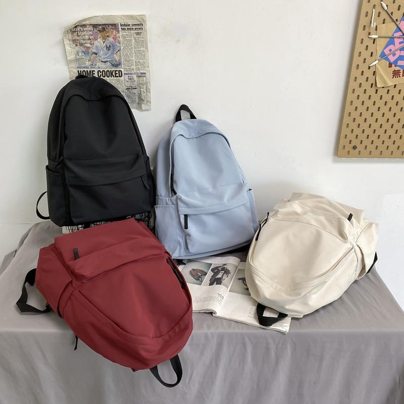Schoolbag backpack ins trendy new Korean version of female high school junior high school students large capacity simple solid color schoolbag male