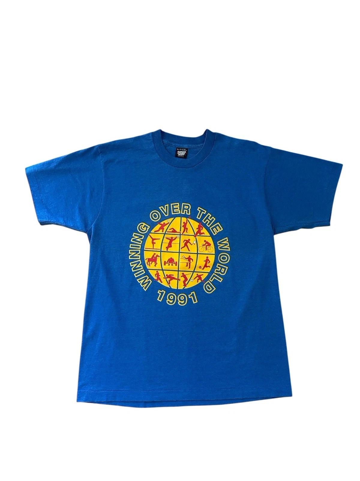 

Vintage Winning Over The World T Shirt Men’s XL Blue 1991 USA 90’s L