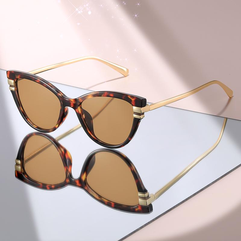 Fashion Cat Eye Sunglasses with Black Top Frame, Red Patterned Lower Frame, Gold Metal Arms, and Gradient Brown Lenses For