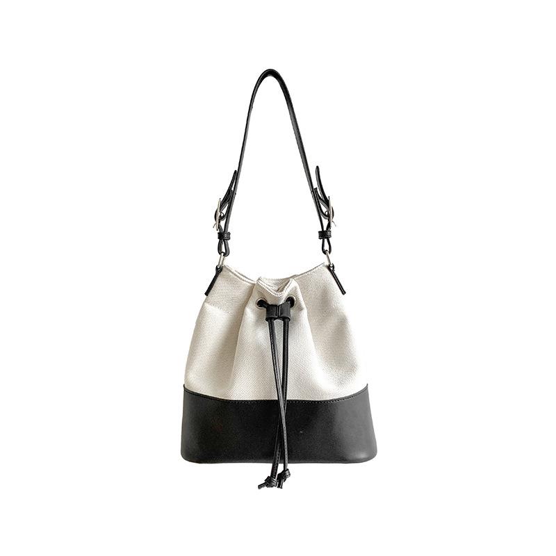 Neue koreanische Patchwork-Schultertasche mit Kordelzug für Damen, modisches Nischenprodukt, geräumige Canvas-Tasche für Pendler