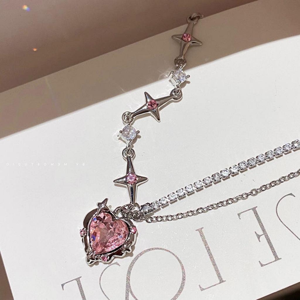 A Single-piece Pink, Understated Luxury Necklace for Women. Features a Minimalist Style with Diamond, Heart, and Star Patterns,